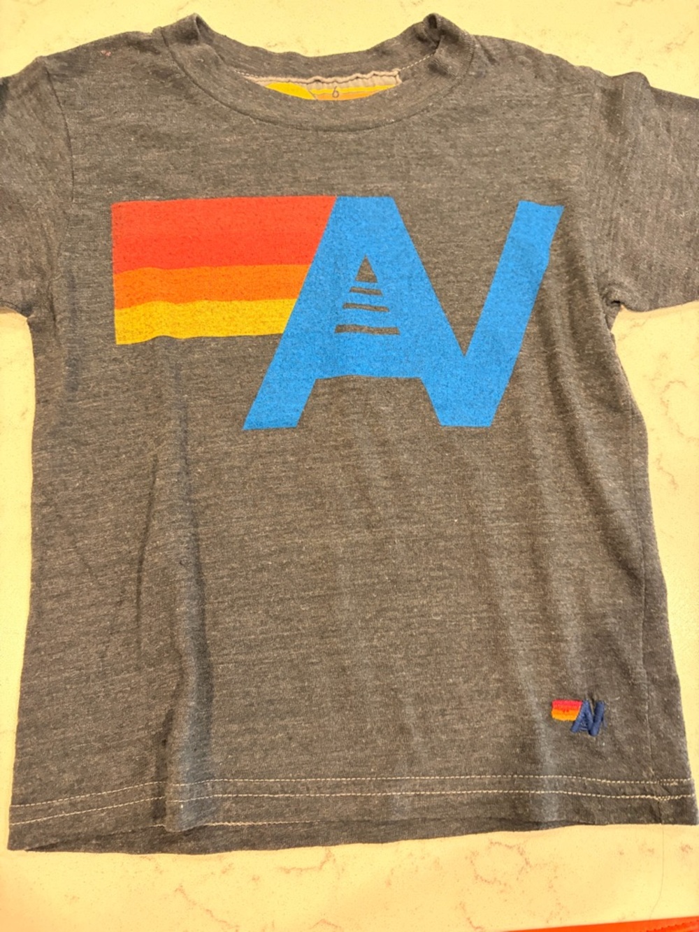 Aviator Nation Kids Heather Gray Tee with Blue Logo & Red-Orange-Yellow Stripe